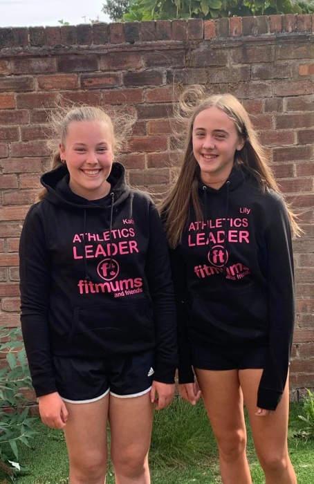 Athletics Leaders Katie and Lily in their black Fitmums & Friends hoodies.