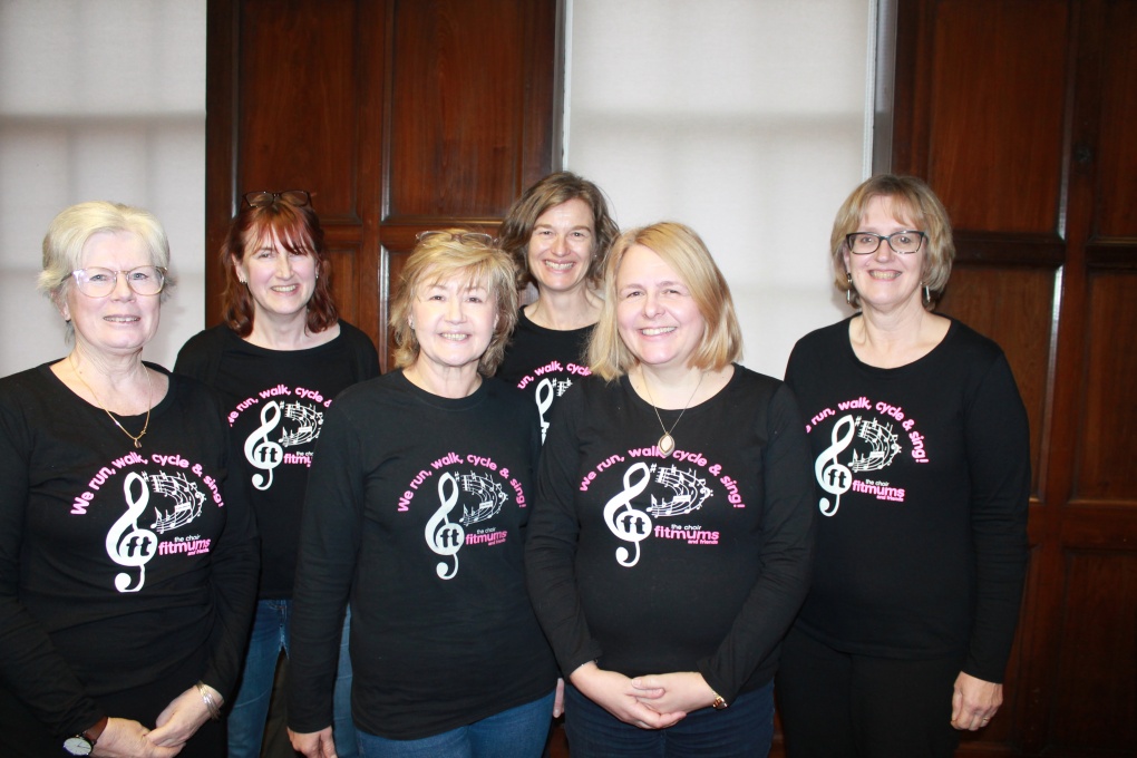 Six choir members in choir t-shirts