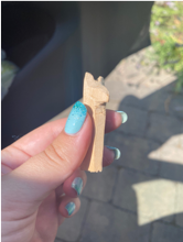 small carved, wooden animal
