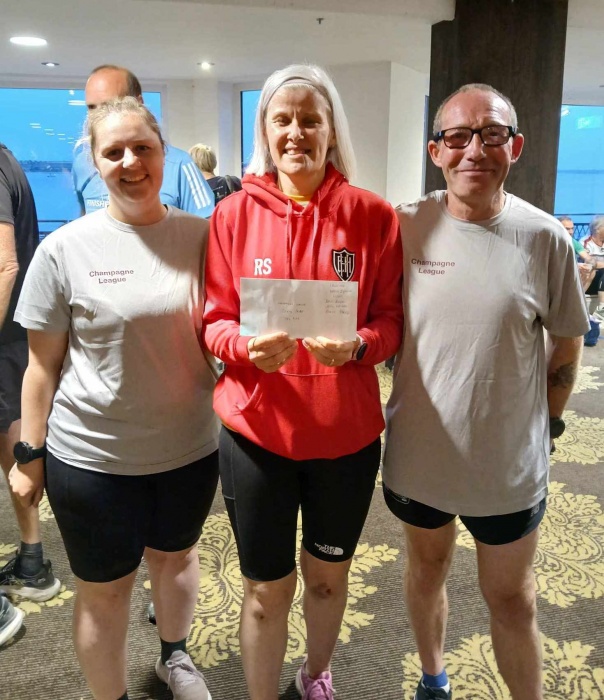 The three members of the East Hull team pose together holding their prize envelope