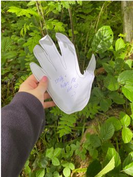 Emily's name written on a paper hand